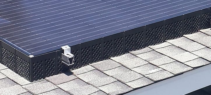 SolaTrim installed on a roof with solar panels.